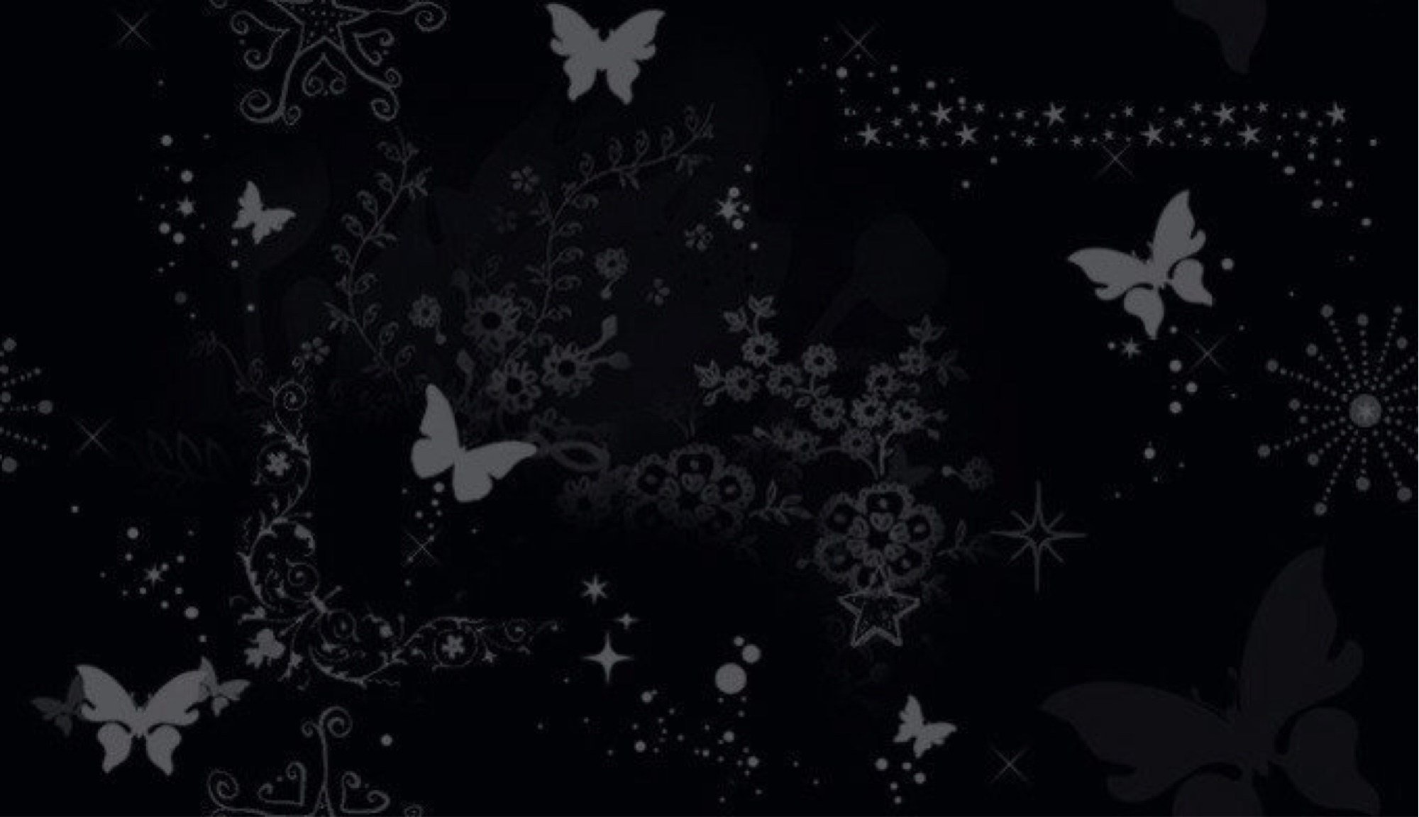 Мелкие бабочки на черном фоне